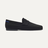 side | The Ravello Penny Loafer in Black shown from the side.