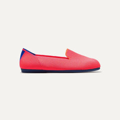 side | The Kids slip-on Loafer in Flamingo shown from a side view showing the outsole.