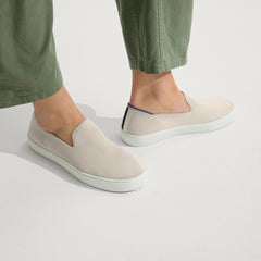 hover | The Original Slip On Sneaker in Sand shown on a model.