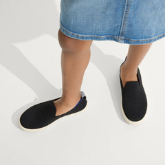 hover | Model wearing The Kids Sneaker in Black. 