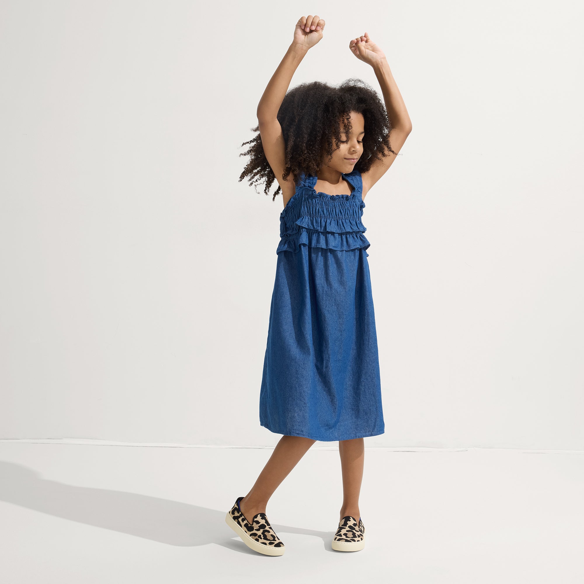 model | Alternate view of a model wearing The Kids Sneaker in Desert Cat.