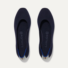 A pair of The Square toe flat shoe in Navy shown from the top view.