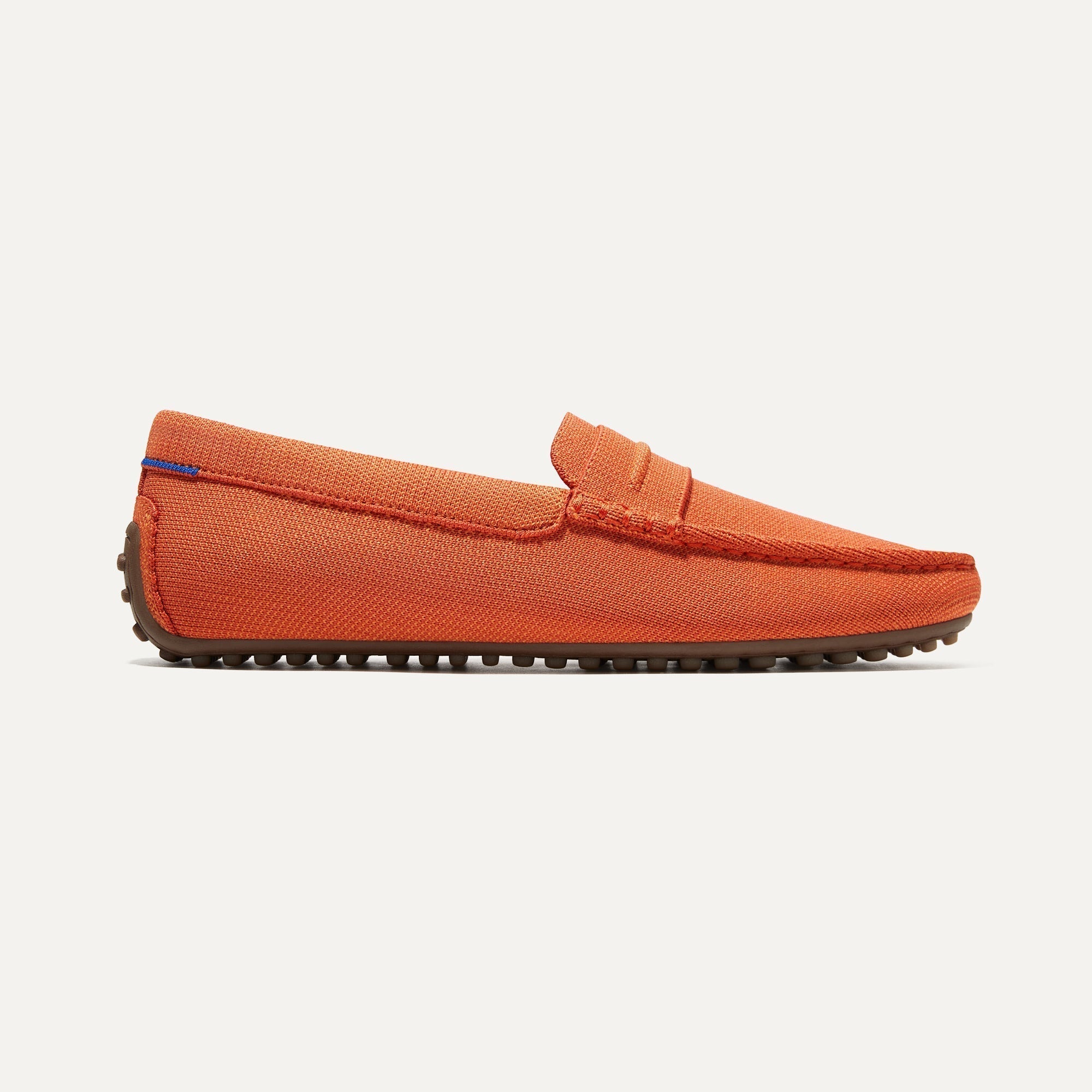The Driving Loafer in Apricot shown from the side. 