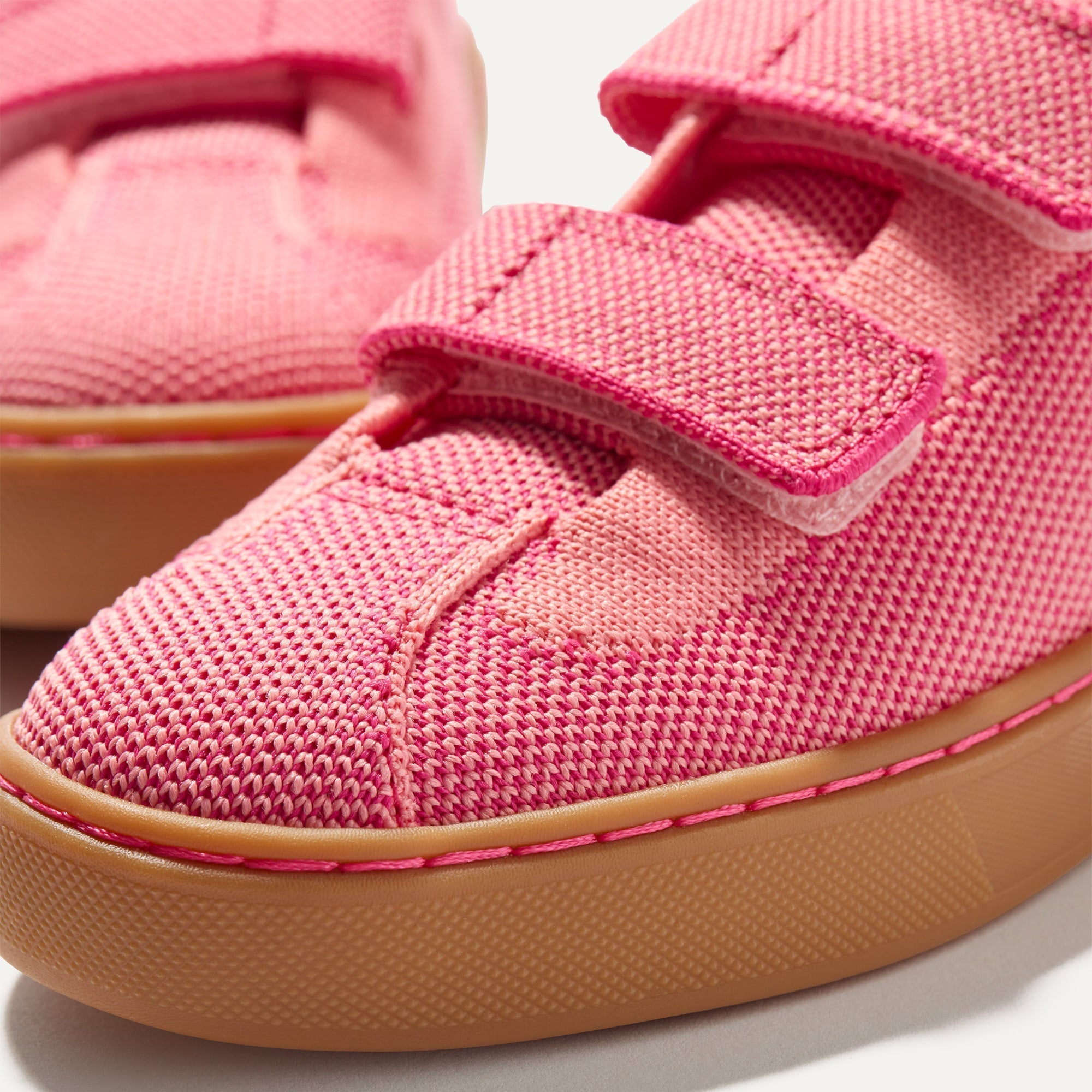Close up of the vamp of The Kids Strap Sneaker in Watermelon. 