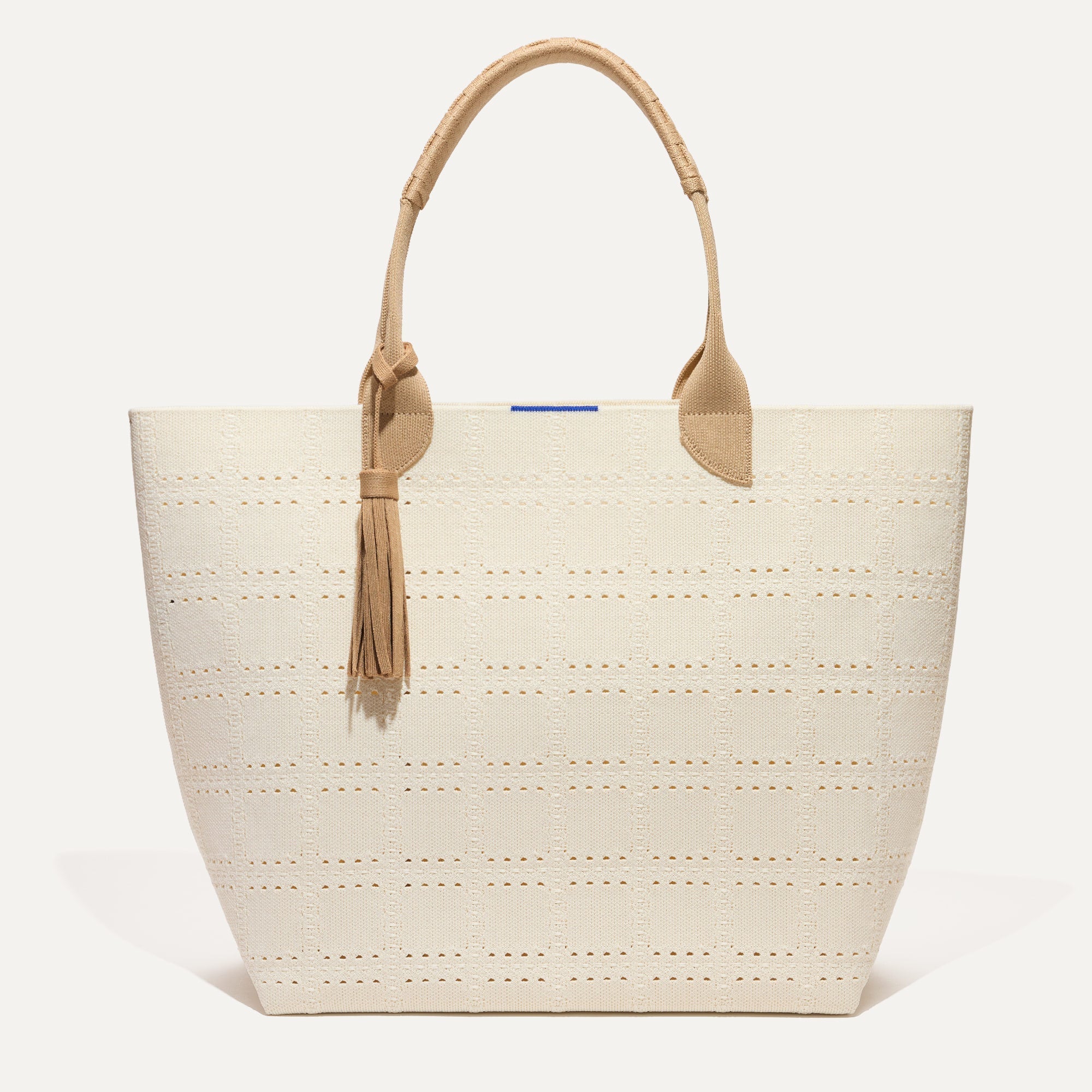 PLP |The Lightweight Tote in Ivory Perf shown from the front. 
