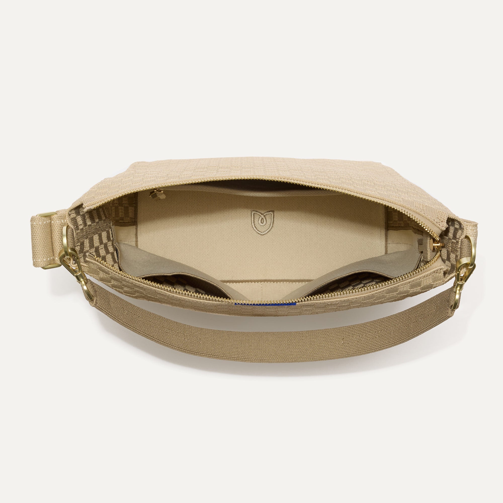 The Mini Zip Bucket in Knot Brown shown from the top down, with zipper open and interior exposed.
