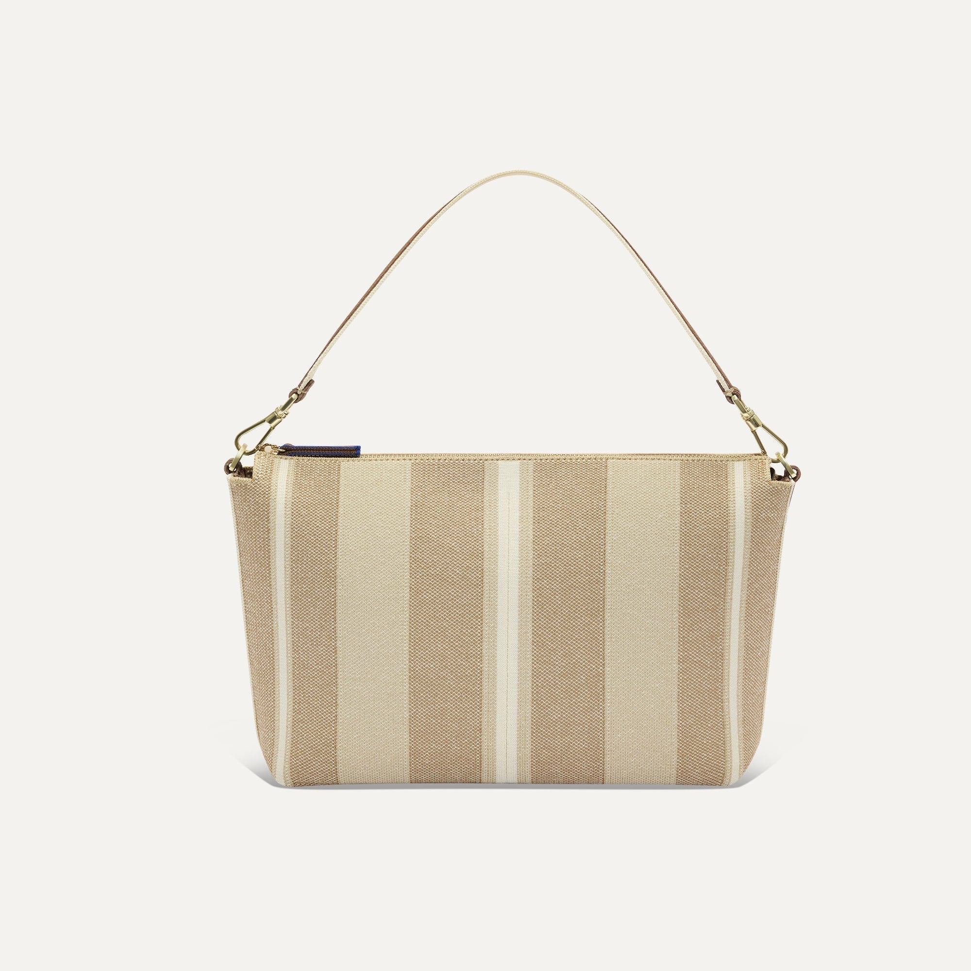 PLP |The Daily Crossbody Bag in Oat Latte shown from the front.