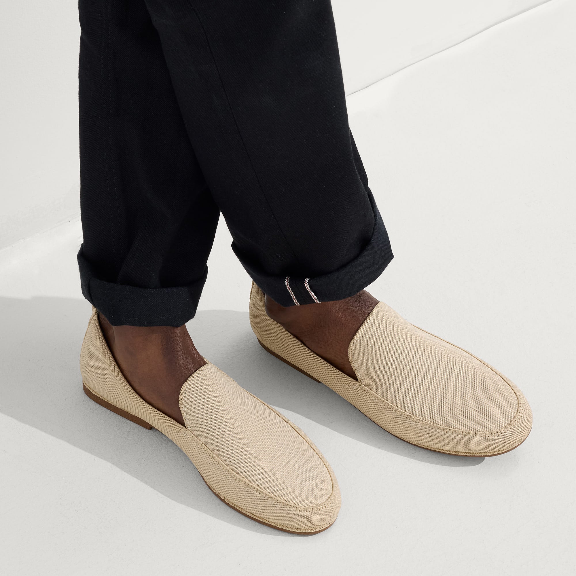 hover | Model wearing The Ravello Loafer in Sand. 