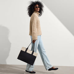 hover | The Classic Tote in Luna, worn over the shoulder by a model, shown from the side.