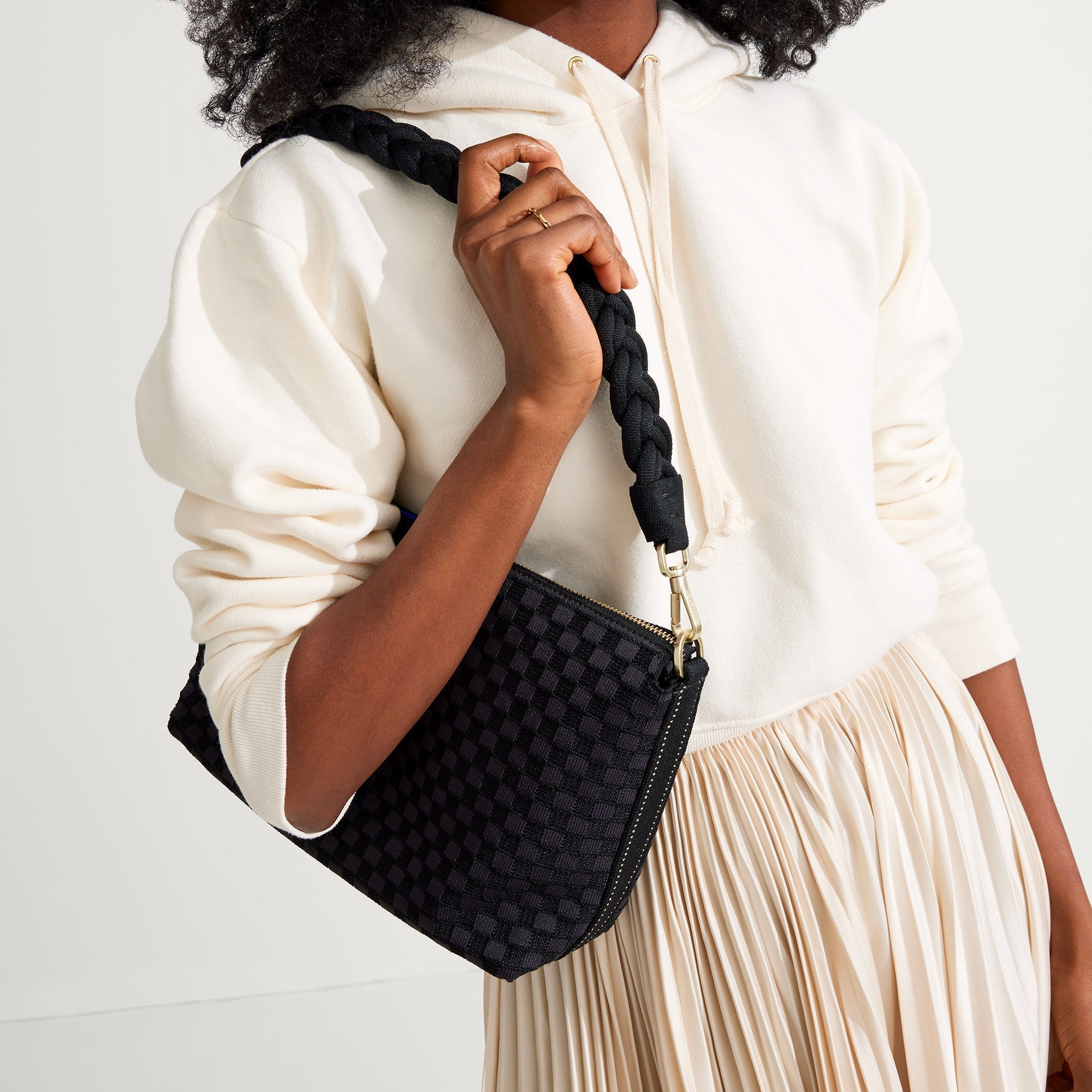 hover | The Braided Shoulder Strap in Black, shown paired with The Daily Crossbody, worn by a model and shown from the side. 