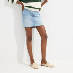 hover | Model wearing The Double Bit Loafer Mule in Sandstone. 