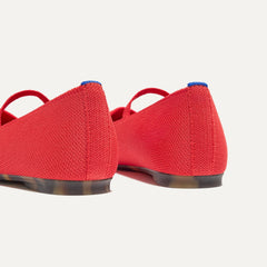 Close up of the heel of The Max Square Mary Jane in Red Hot, with Rothy's signature blue halo.