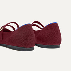 Close up of the heel of The Double Buckle Mary Jane in Cabernet, with Rothy's signature blue halo.