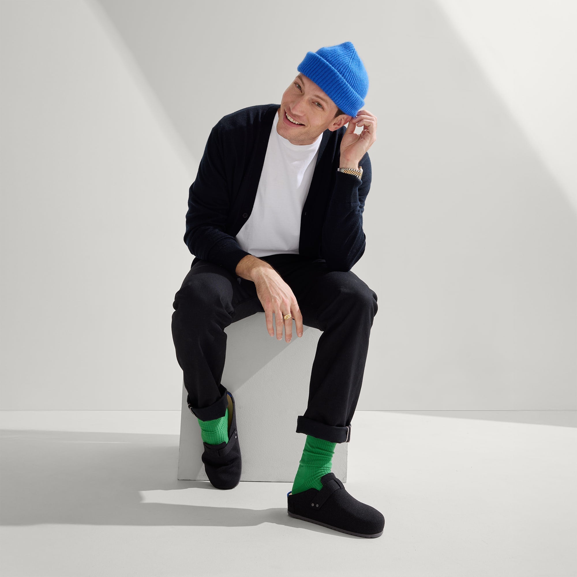 model | Alternate view of a model wearing The Men's Clog in Soft Black. 