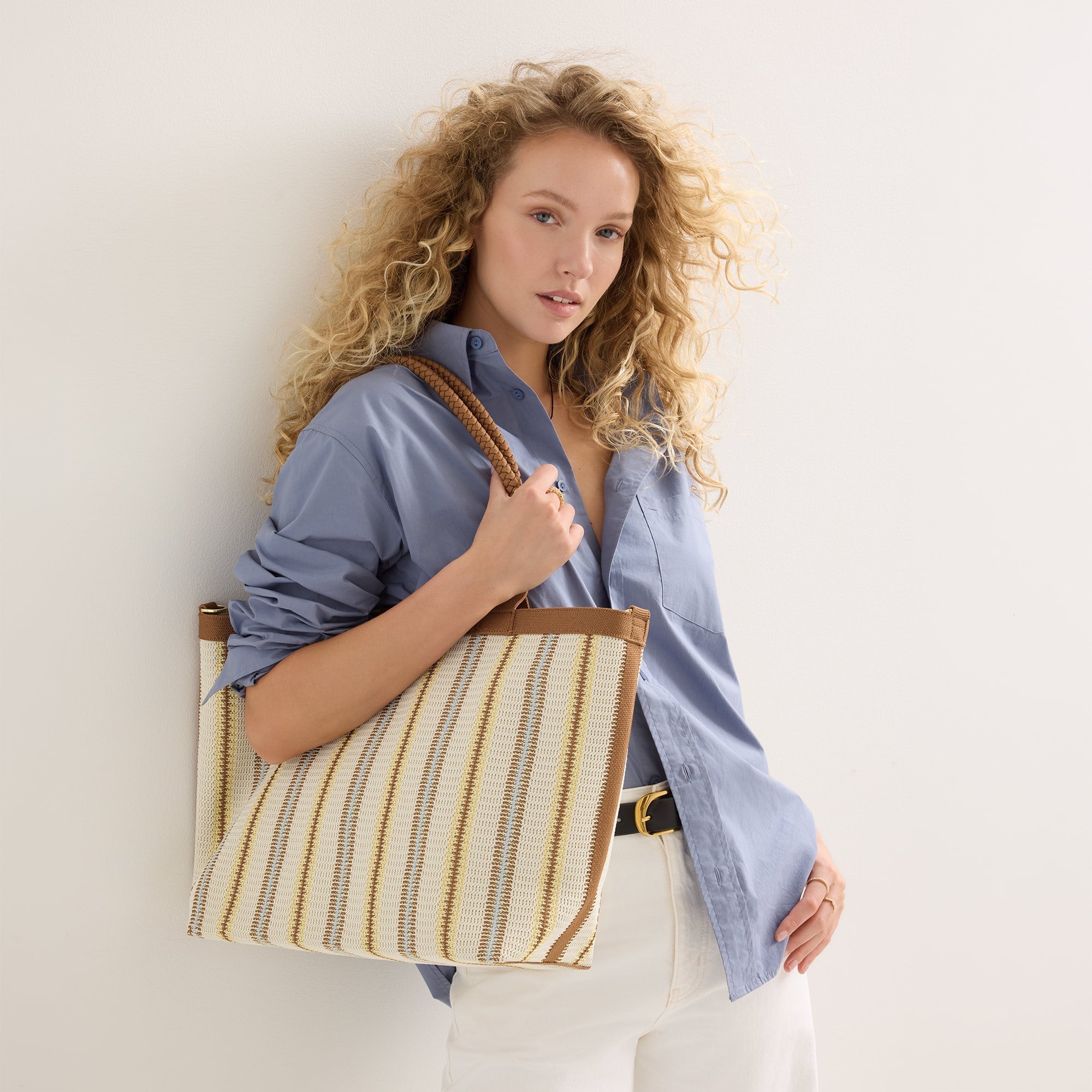 hover | Model holding The Lightweight Zip Tote in Sunbeam Market Stripe.