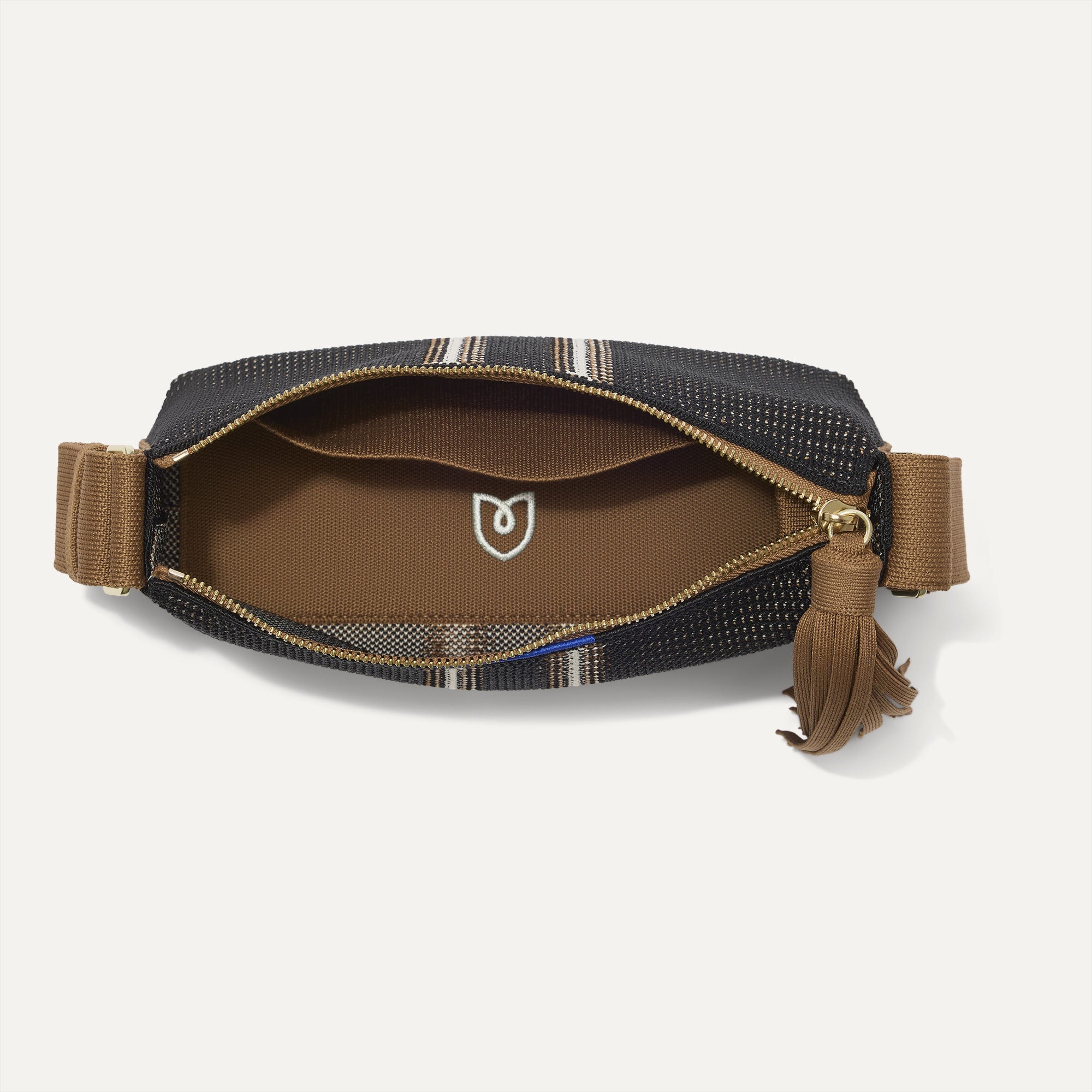 The Casual Crossbody in RCoffee Market Stripe, shown from above, with the interior exposed.