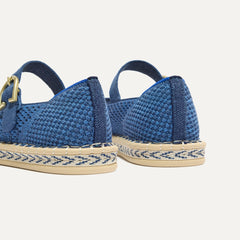 Close up of the heel of The Espadrille Mary Jane in Blue Breeze, with Rothy's signature blue halo. 