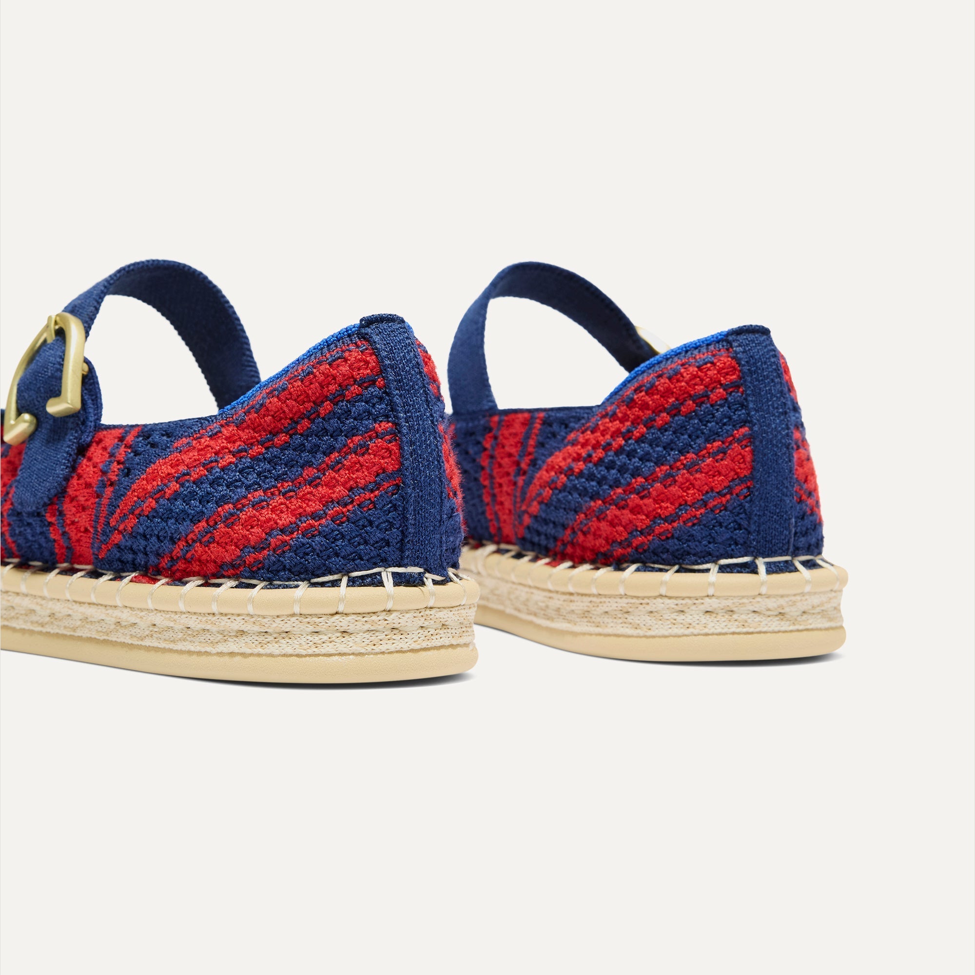 Close up of the heel of The Espadrille Mary Jane in Cherry Tide, with Rothy's signature blue halo. 
