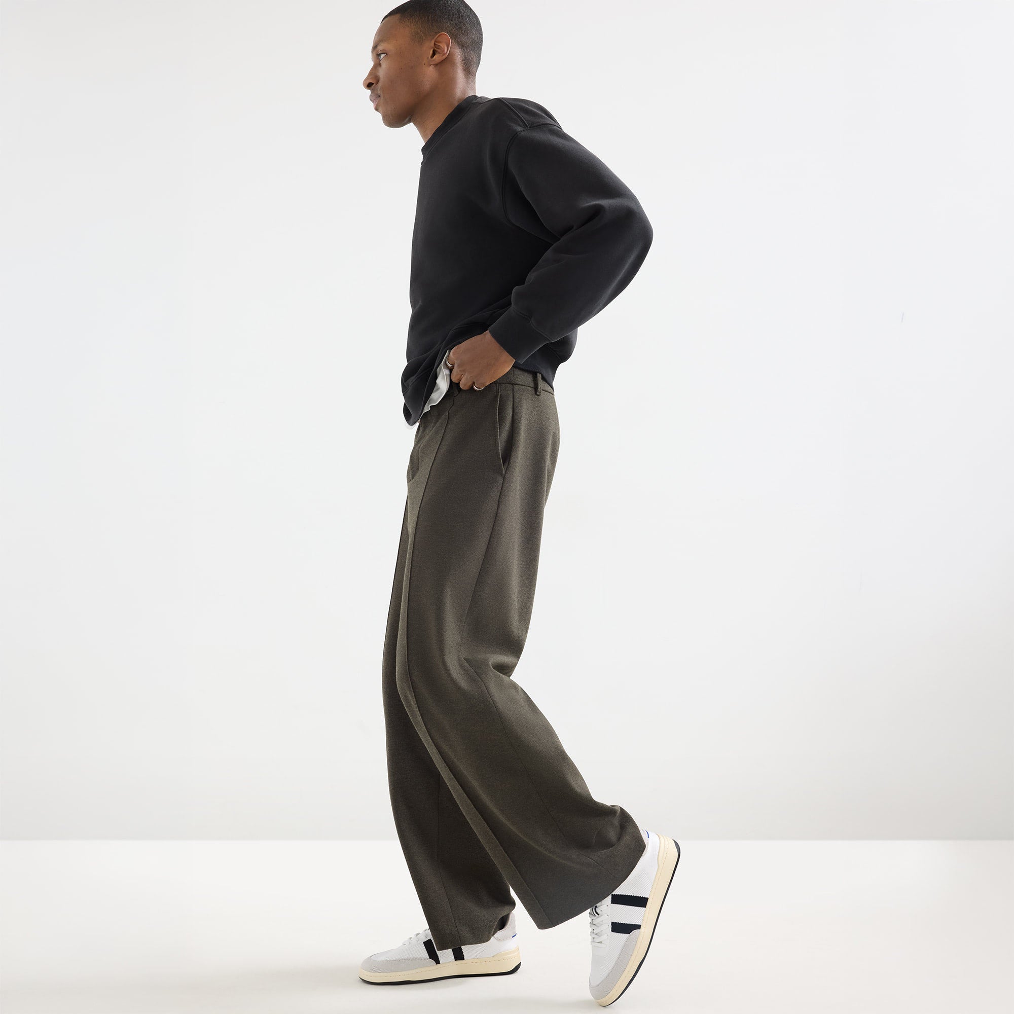 model | Alternate view of a model wearing The Men's Court Sneaker in Black Drift.