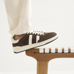 hover | Model wearing The Men's Court Sneaker in Dugout.