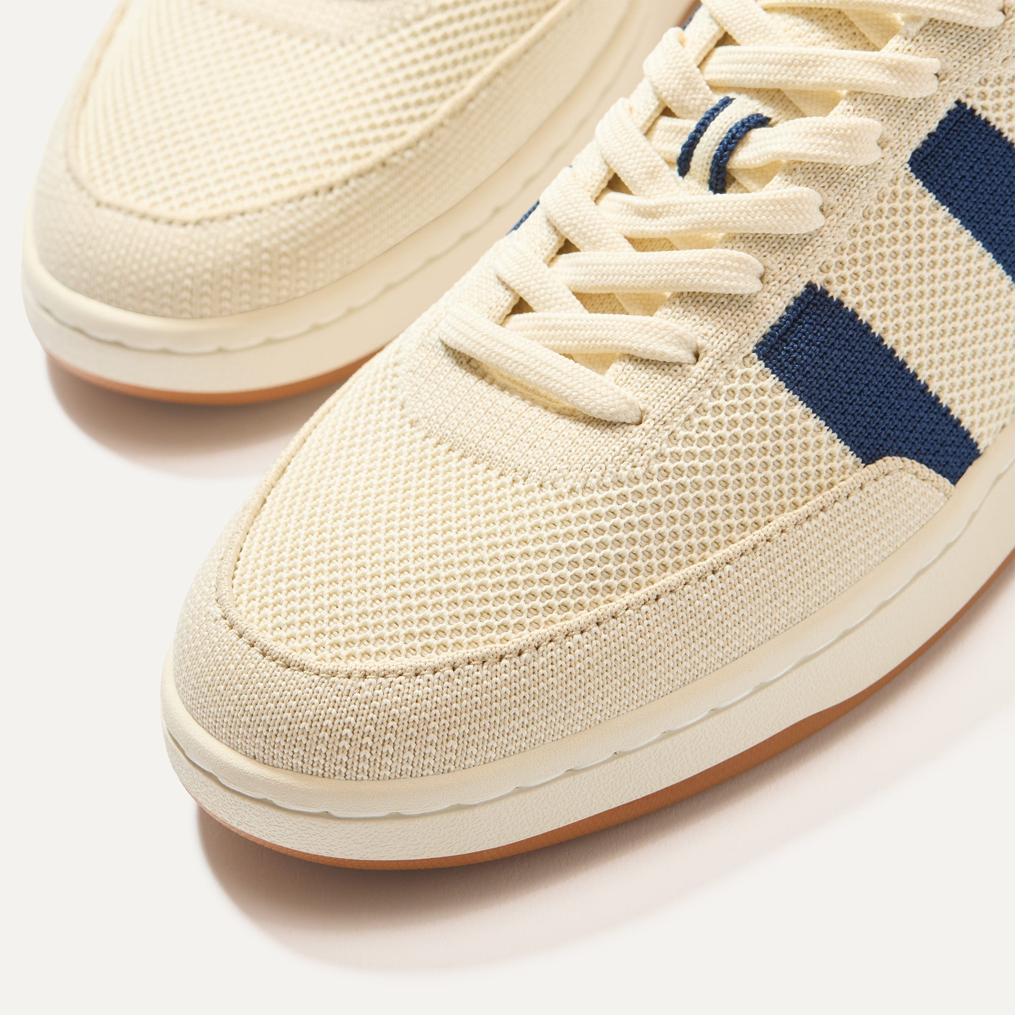 Close up of the toe and stitching details of The Men's Court Sneaker in Freestyle. 