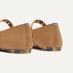Close up of the heel of The Max Buckle Mary Jane in Java Chip, with Rothy's signature blue halo.
