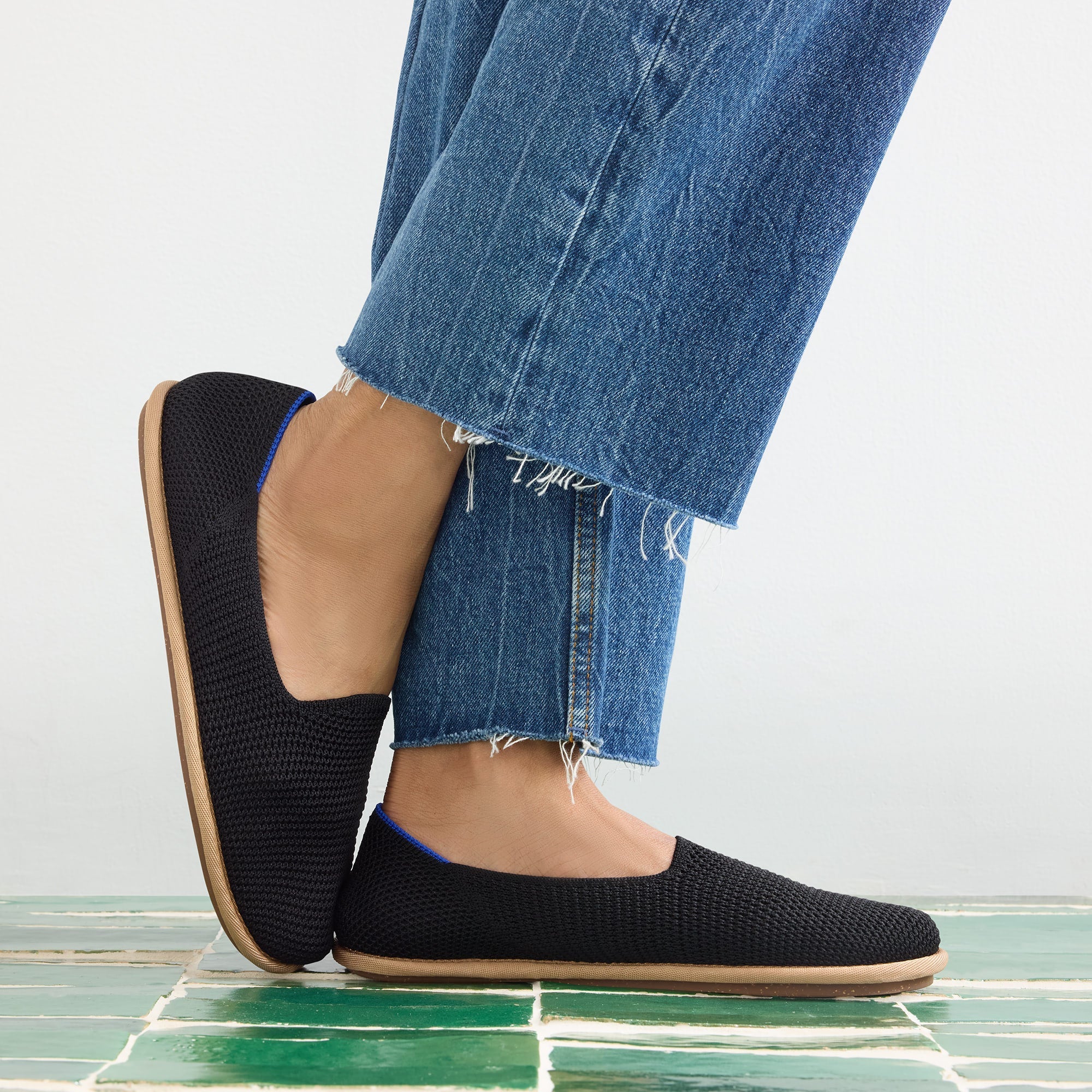 hover | Model wearing The Cruiser Loafer in Black Raffia-Knit.