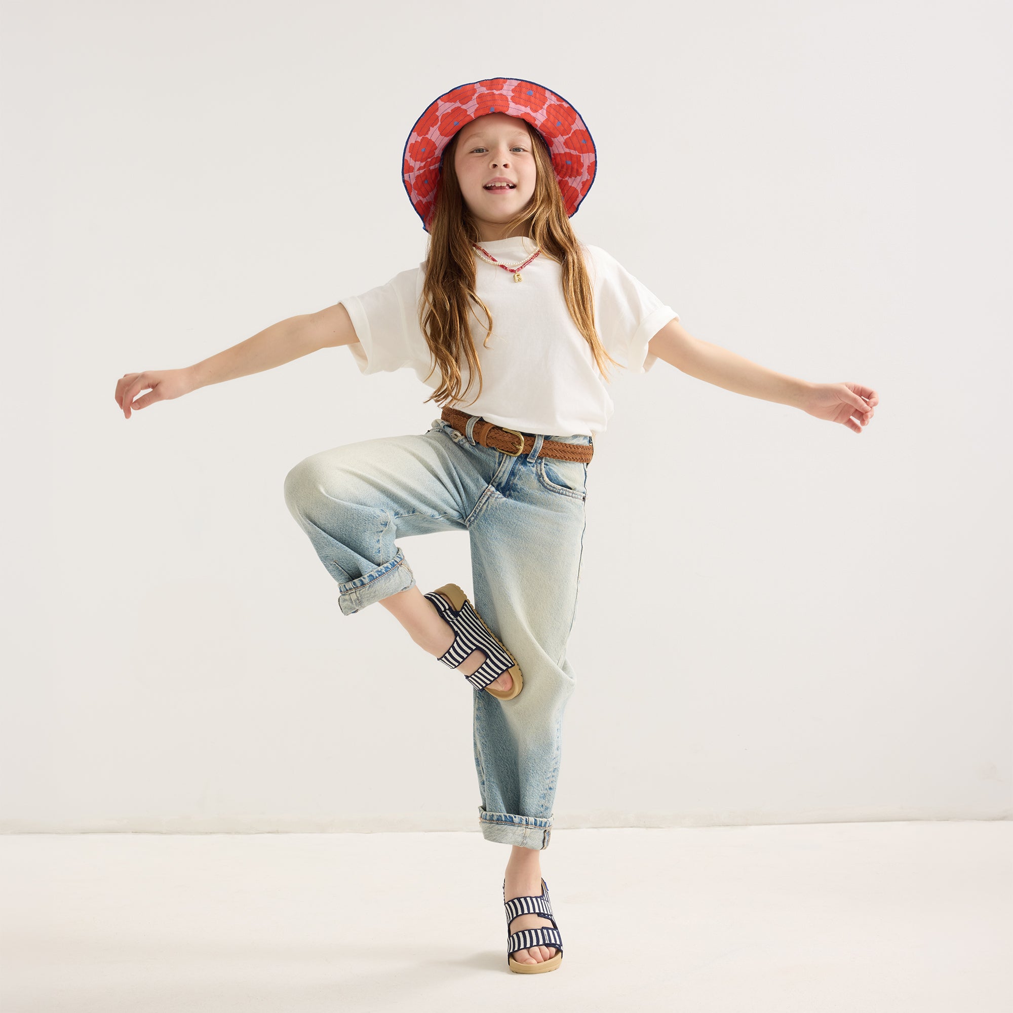 model | Alternate view of a model wearing The Kids Double Strap Sandal in Sailor Stripes.