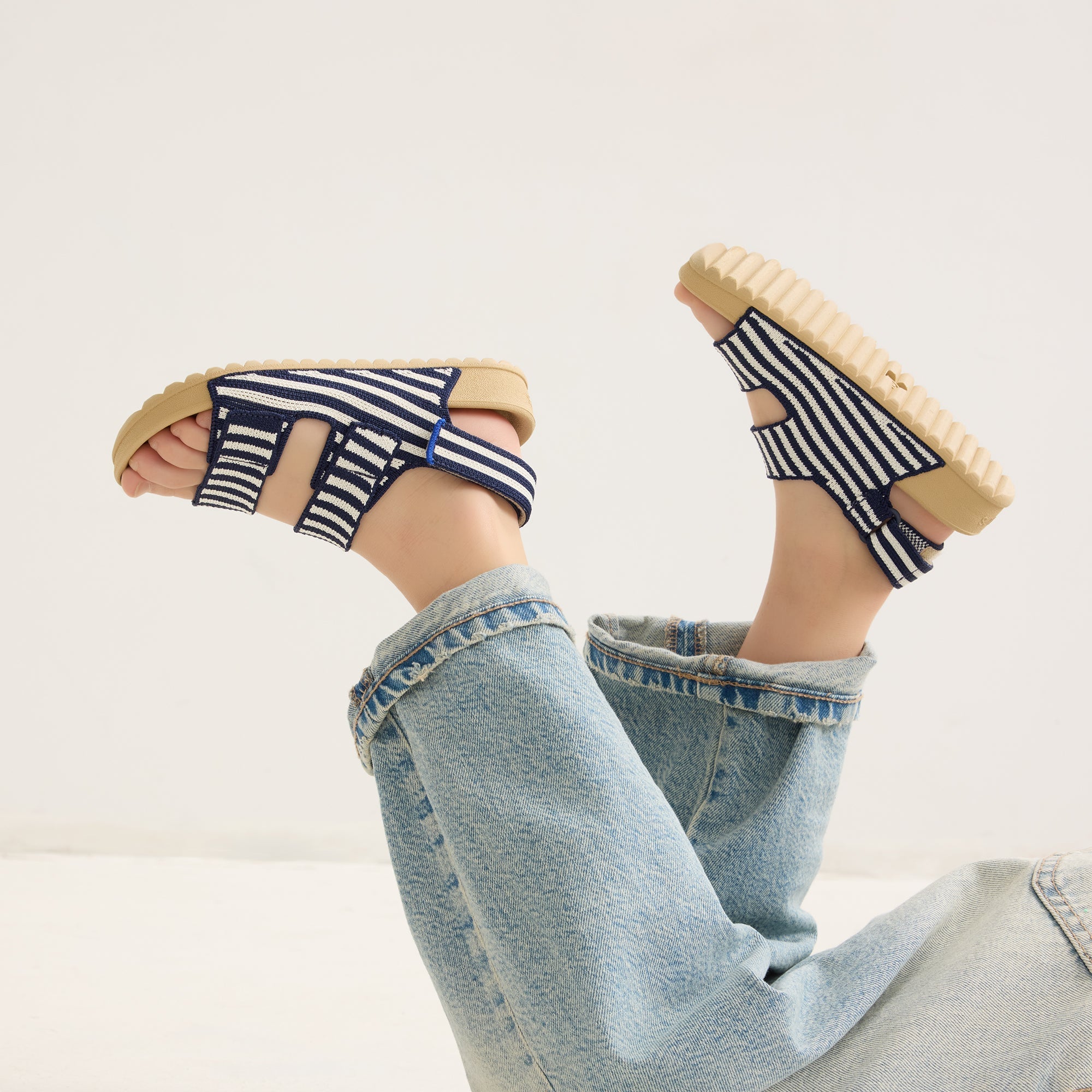 hover | Model wearing The Kids Double Strap Sandal in Sailor Stripes.