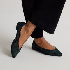 hover | Model wearing The Point III in ReVelvet Evergreen Python. 