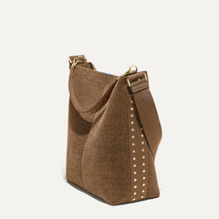 hover | The Bucket Bag in ReVelvet™ shown in a diagonal view.