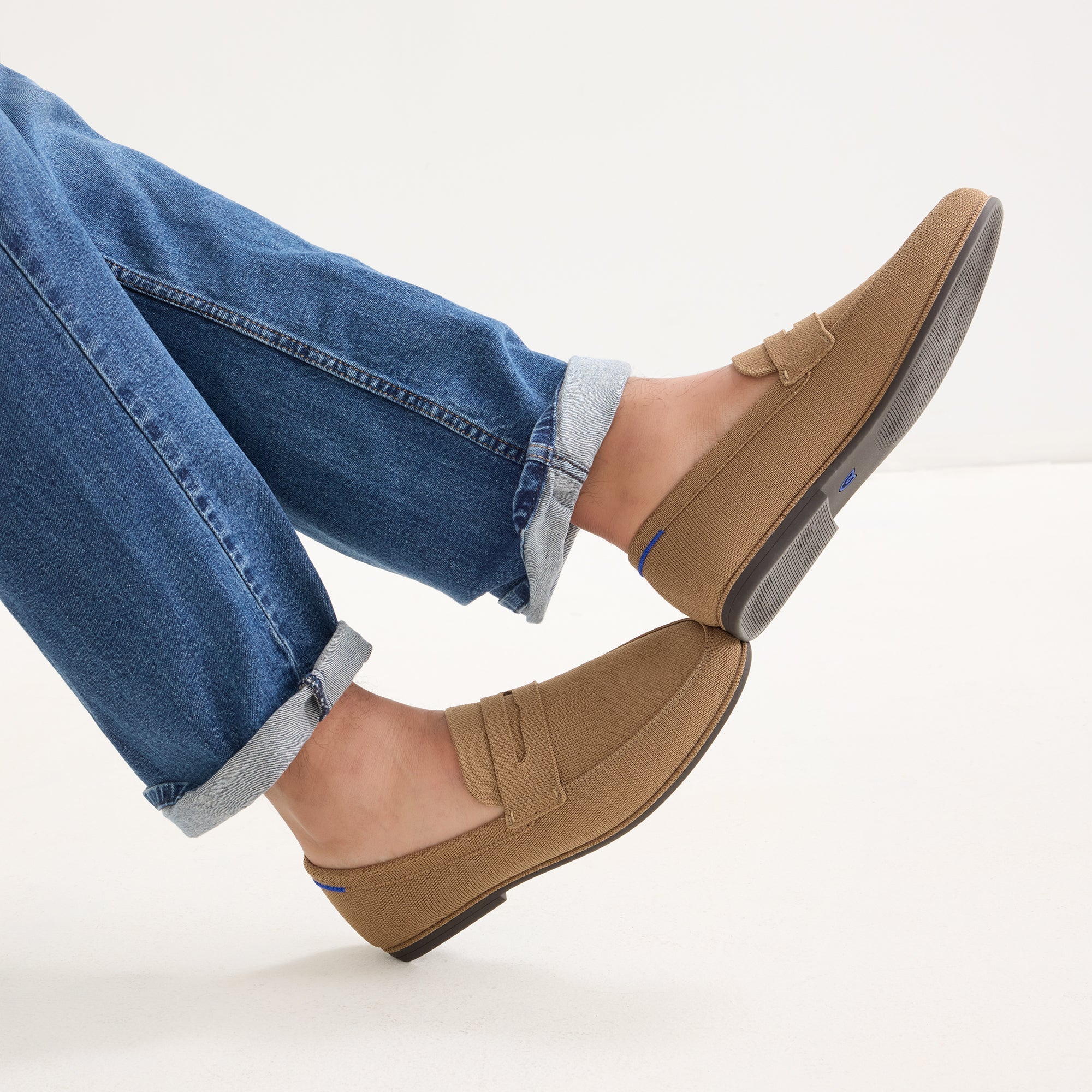 hover | Model wearing The Ravello Penny Loafer in Morel. 