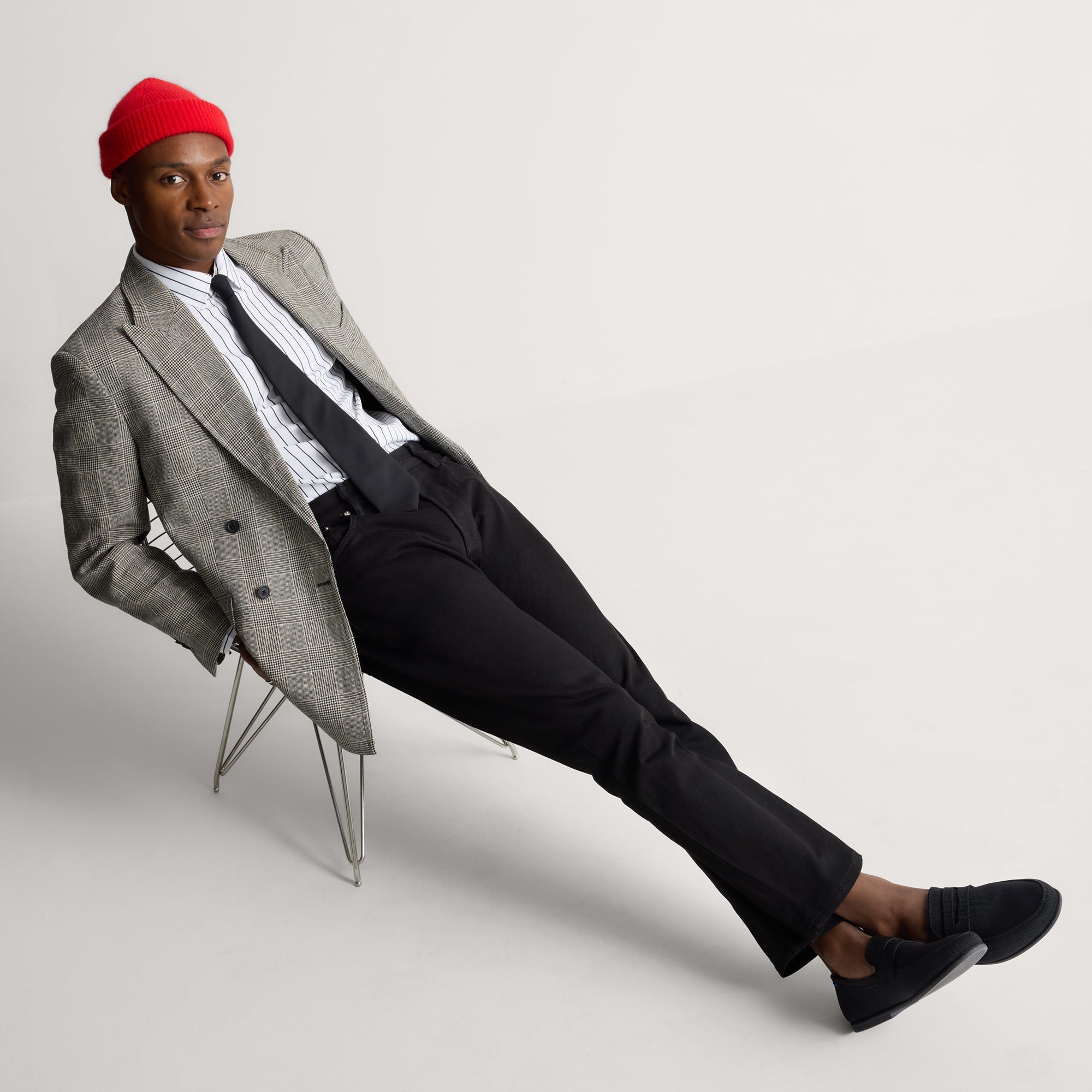 model | Alternate view of a model wearing The Ravello Penny Loafer in Black. 