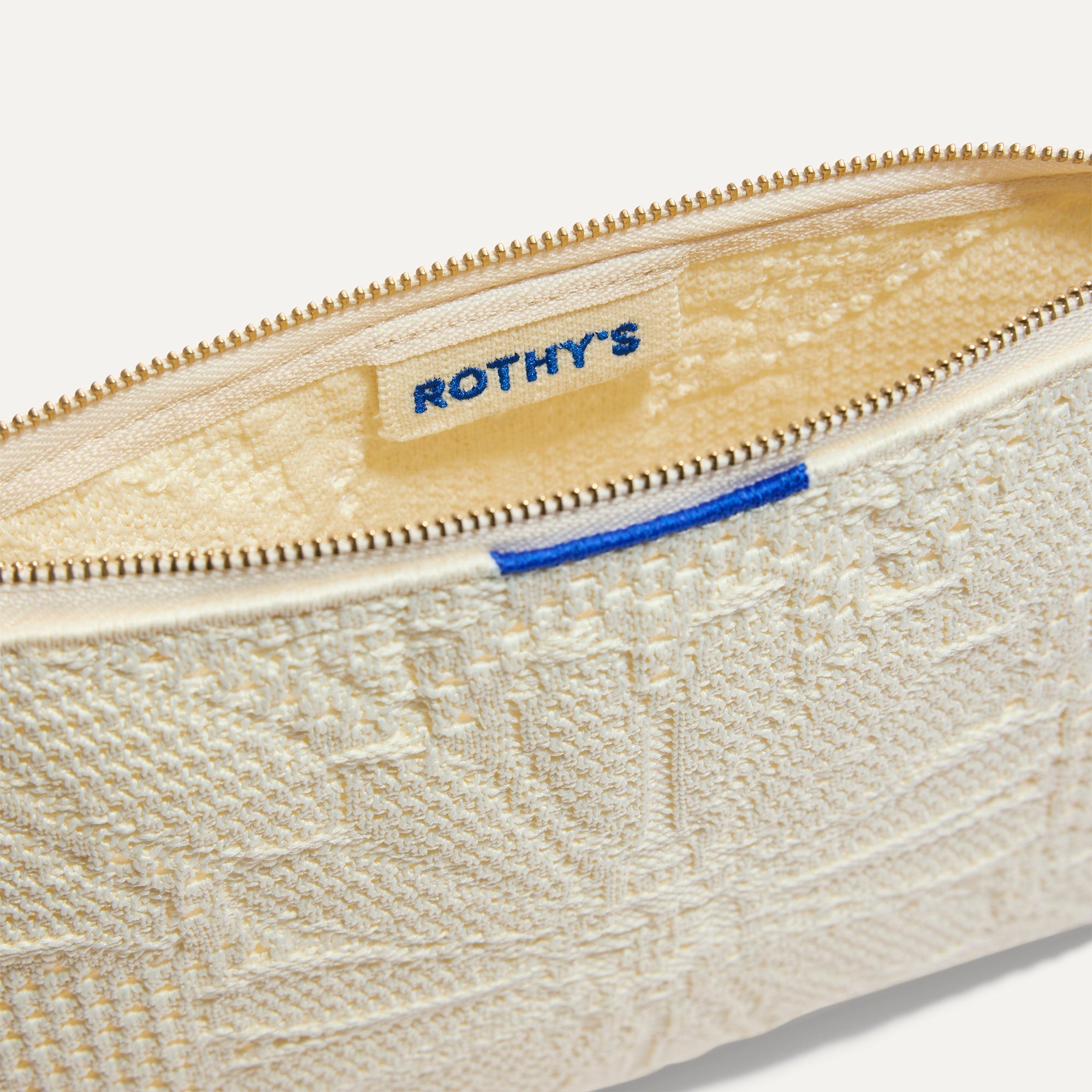 The Convertible Clutch in Moonflower, shown open from the top in diagonal view.