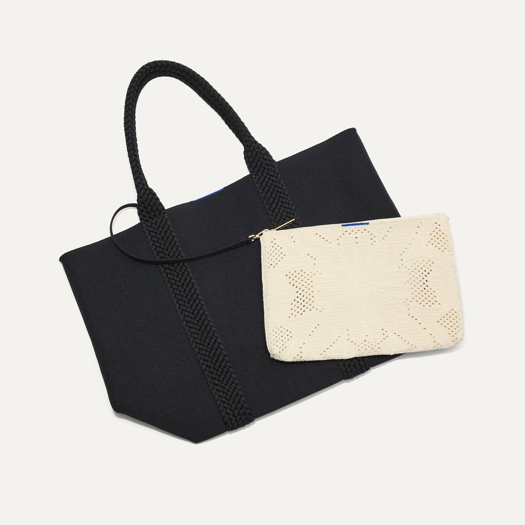 hover | Overlay::Clips onto The Lightweight Tote key leash. | Alt:: The Convertible Clutch in Moonflower, focusing on the strap.