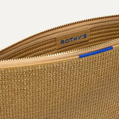 The Convertible Clutch in Glitzy Gold shown open from the top in diagonal view.