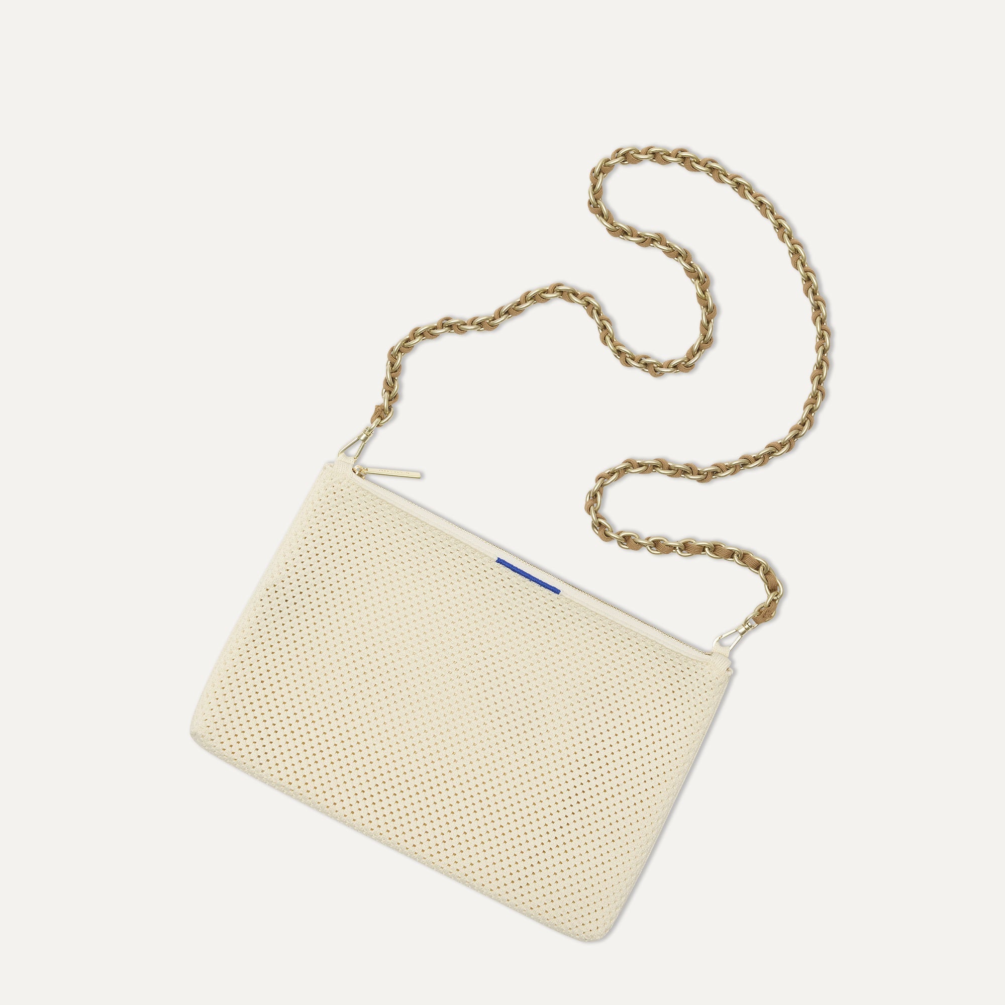 Overlay:: Shown with The Crossbody Strap (sold separately). | Alt:: An image of The Convertible Clutch in Love Bird Open Knit paired with The Crossbody Strap.