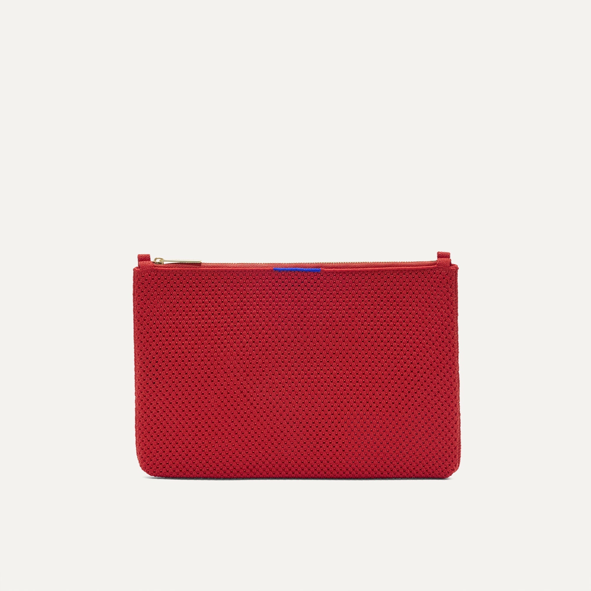 PLP |The Convertible Clutch in Scarlet Open-Knit, shown from the front.