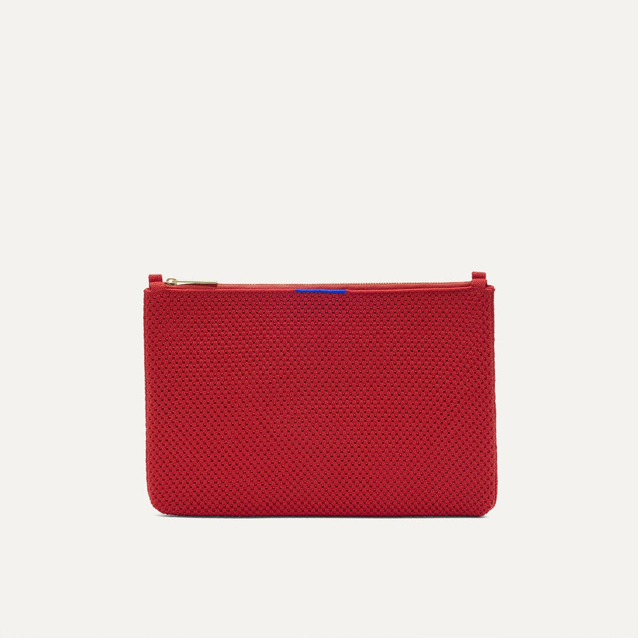 PLP |The Convertible Clutch in Scarlet Open-Knit, shown from the front.