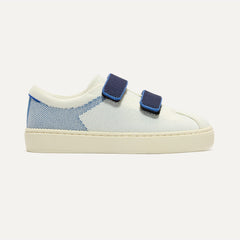 side | The Kids Strap Sneaker in Blue Raspberry shown from the side. 