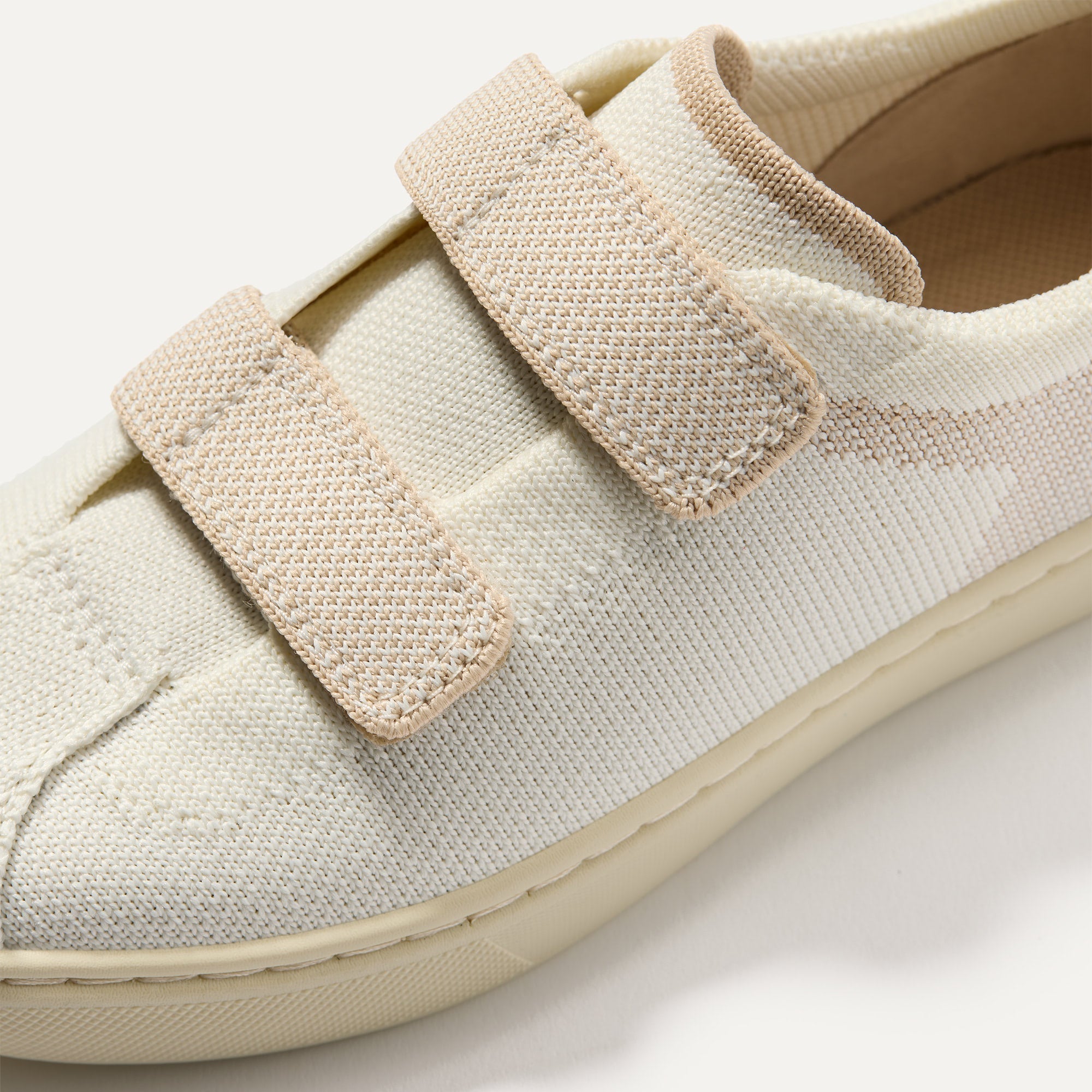 Close up of the vamp of The Kids Strap Sneaker in Vanilla Ice. 