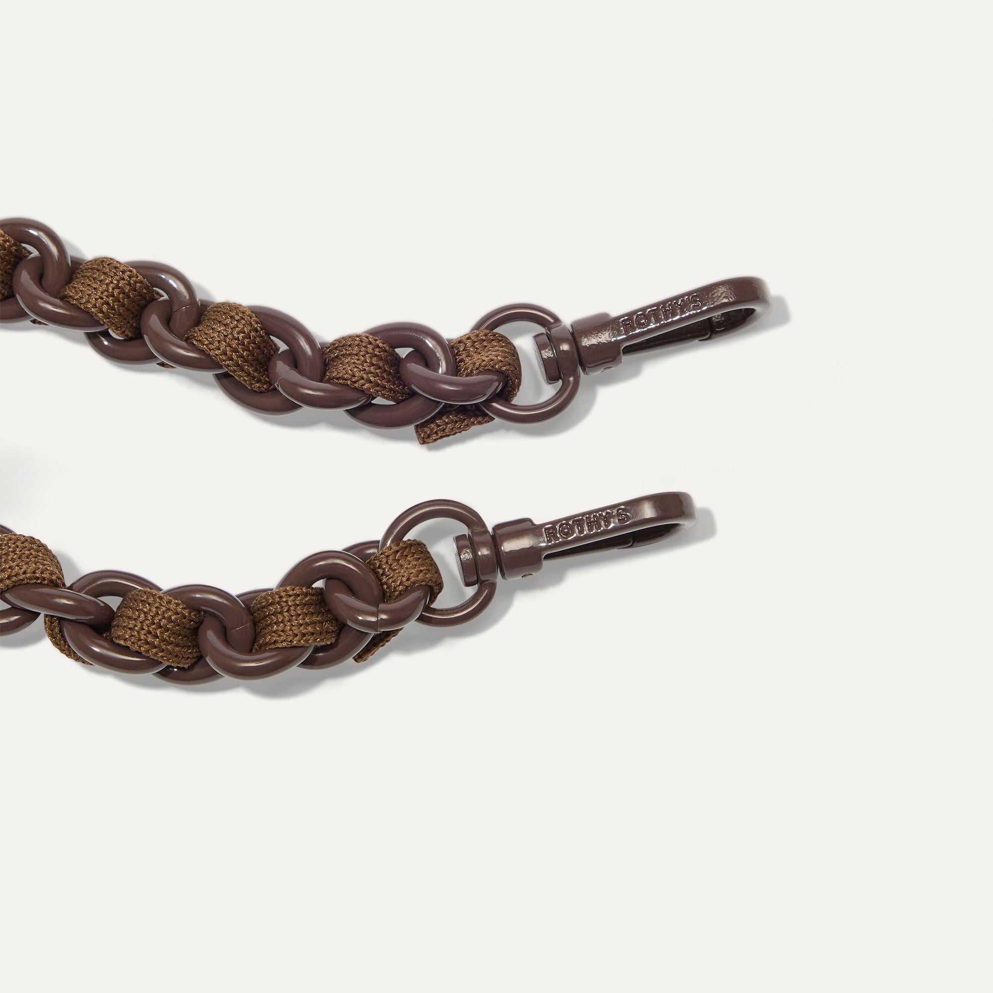 A close-up of The Crossbody Strap in Espresso Chain-Knit, focusing on the end snap hooks.