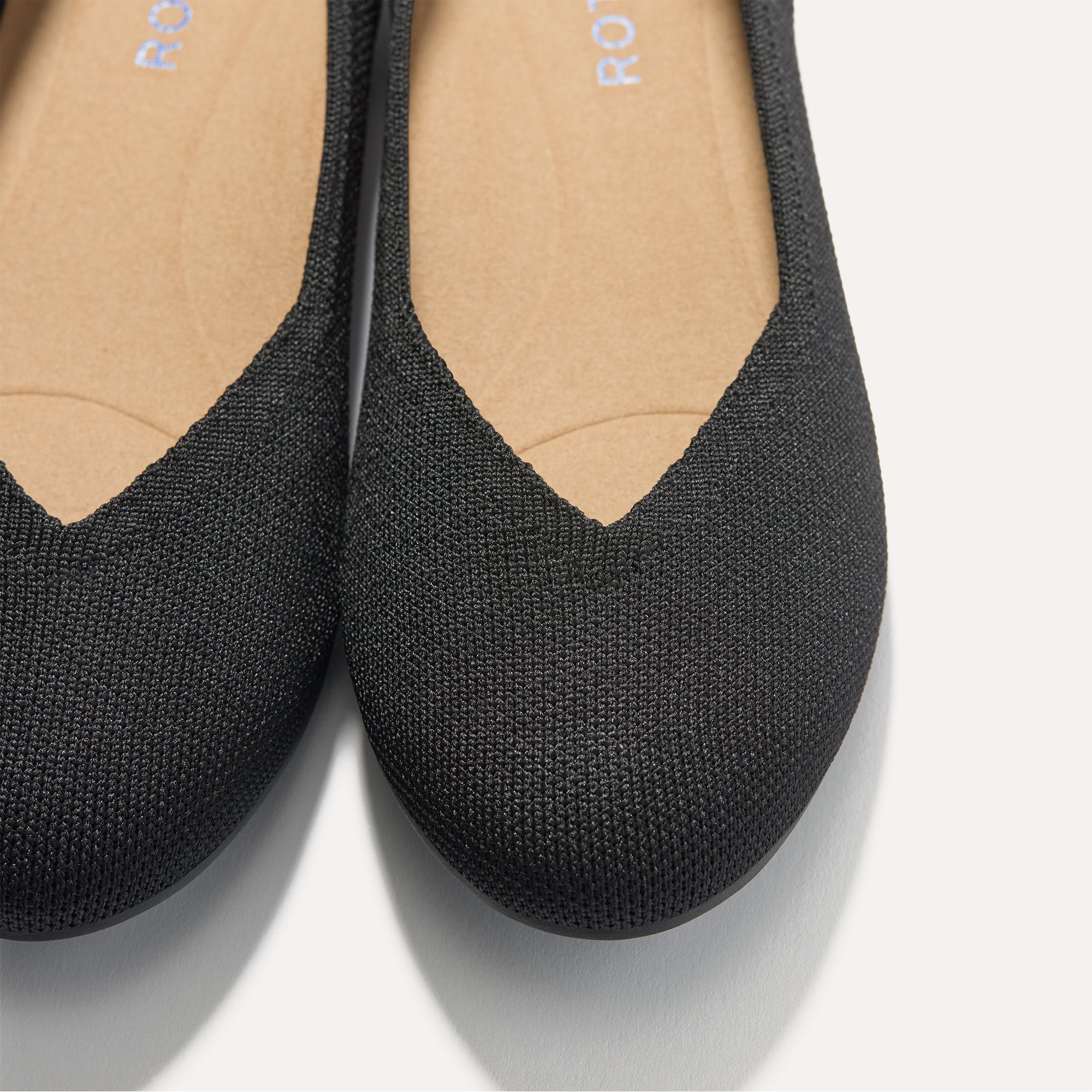 Close up of the toe and vamp of The Daily Flat in Black. 