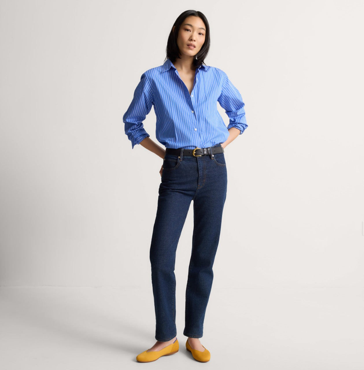 Alternate view of a model wearing The Daily Flat in Marigold. 