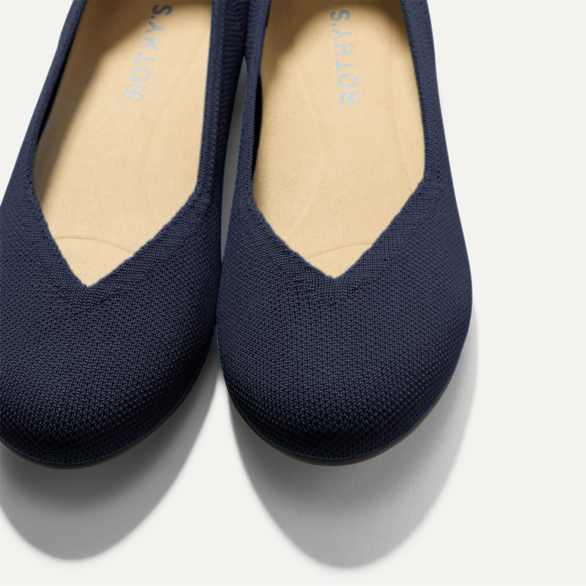 Close up of the toe and vamp of The Daily Flat in Navy. 