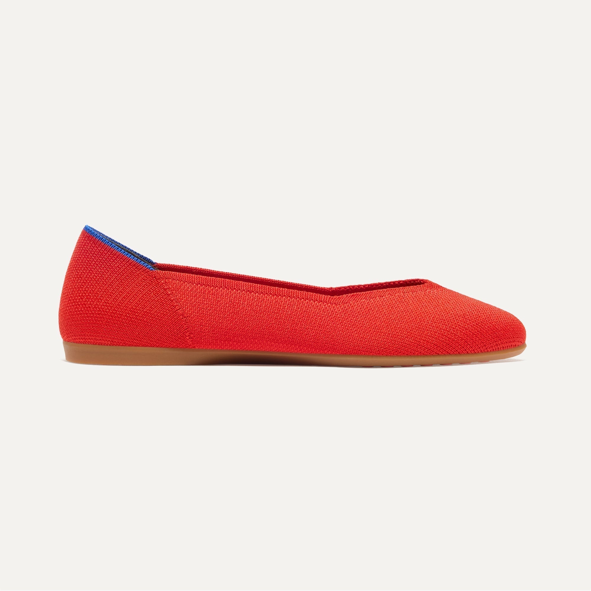 side | The Daily Flat in Showstopper Red shown from the side. 