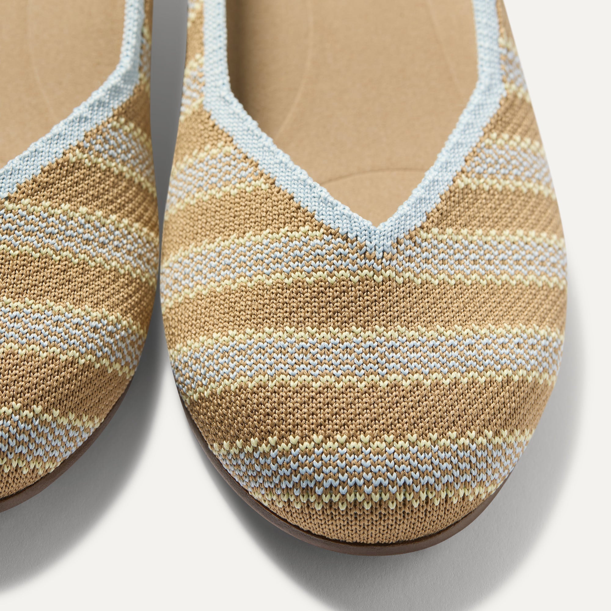 Close up of the toe and vamp of The Daily Flat in Terra Stripe. 