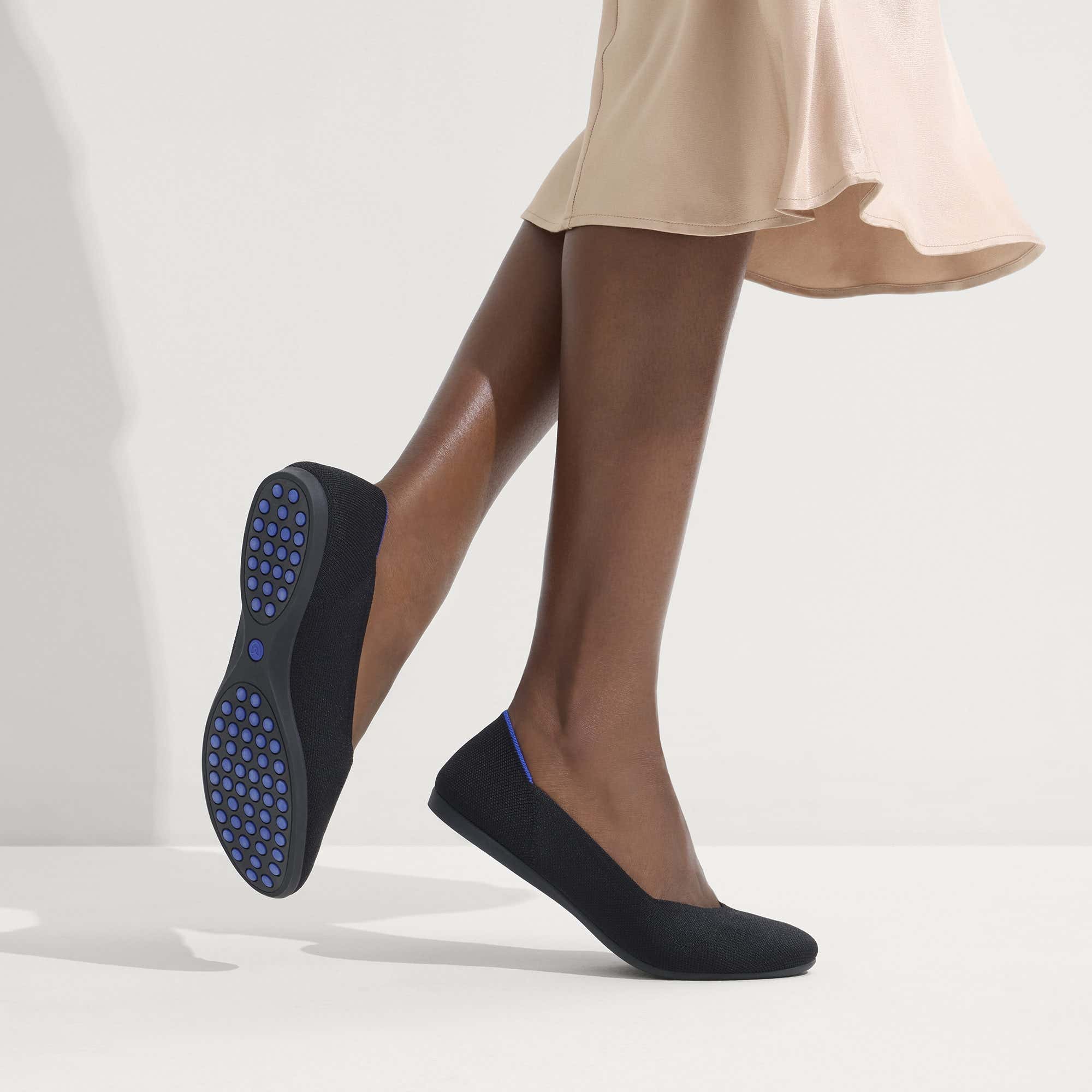 hover | Model wearing The Daily Flat in Black. 