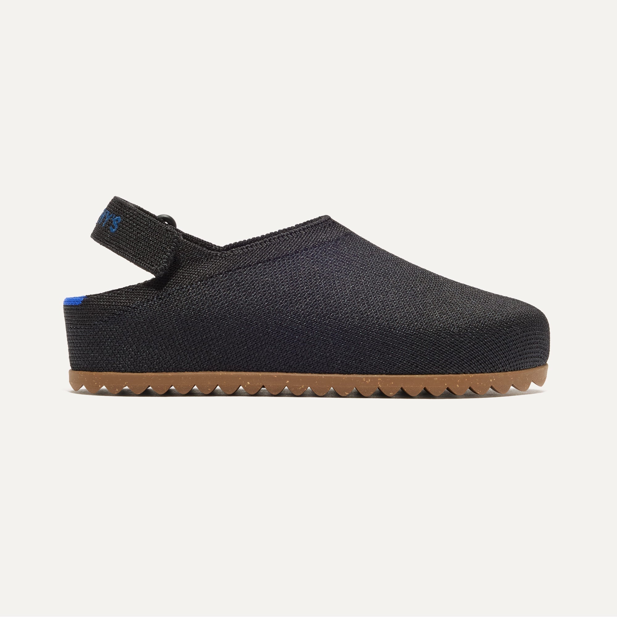 side | The Kids Clog in Black shown from the side. 