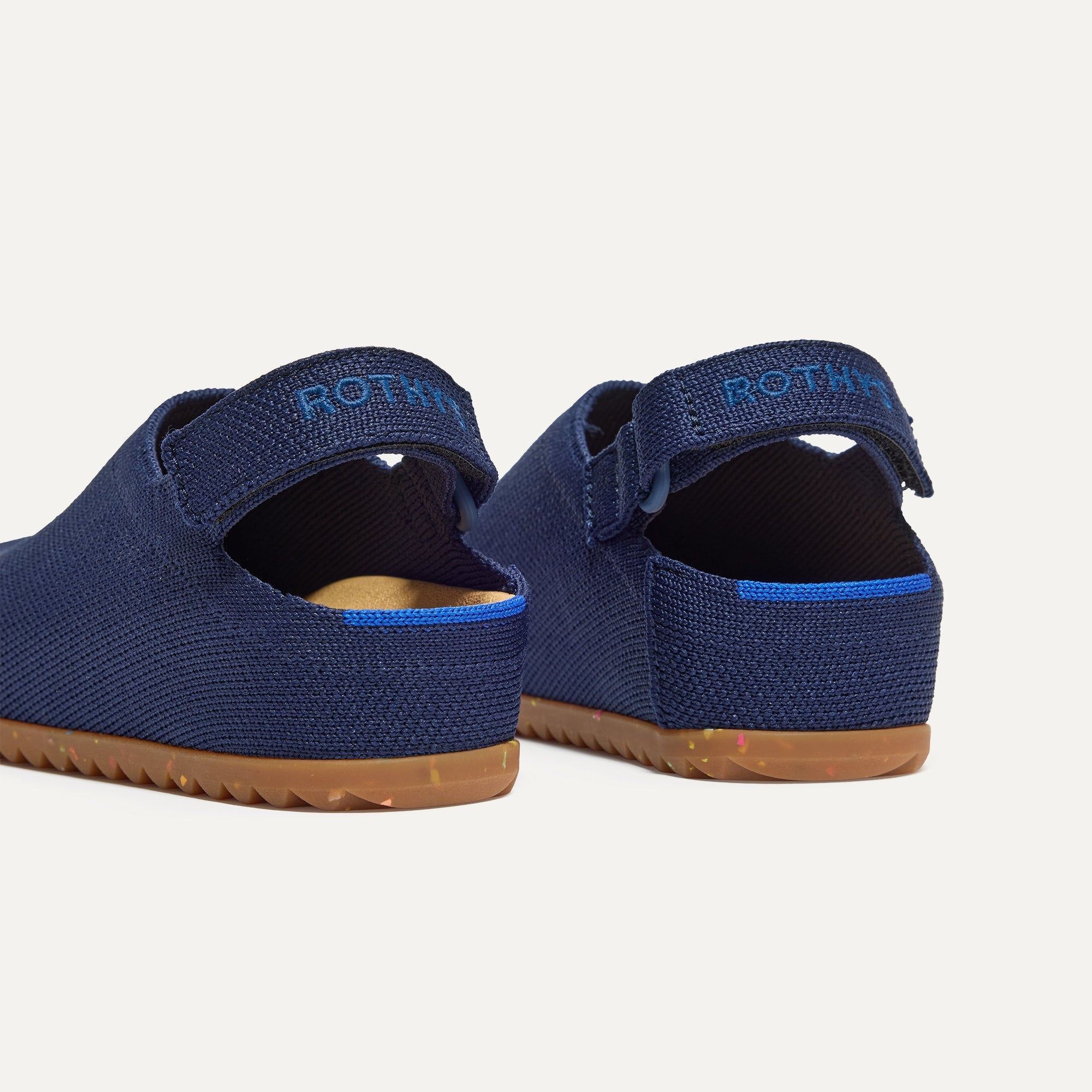 Close up of the heel of The Kids Clog in Deep Navy, with Rothy's signature blue halo. 